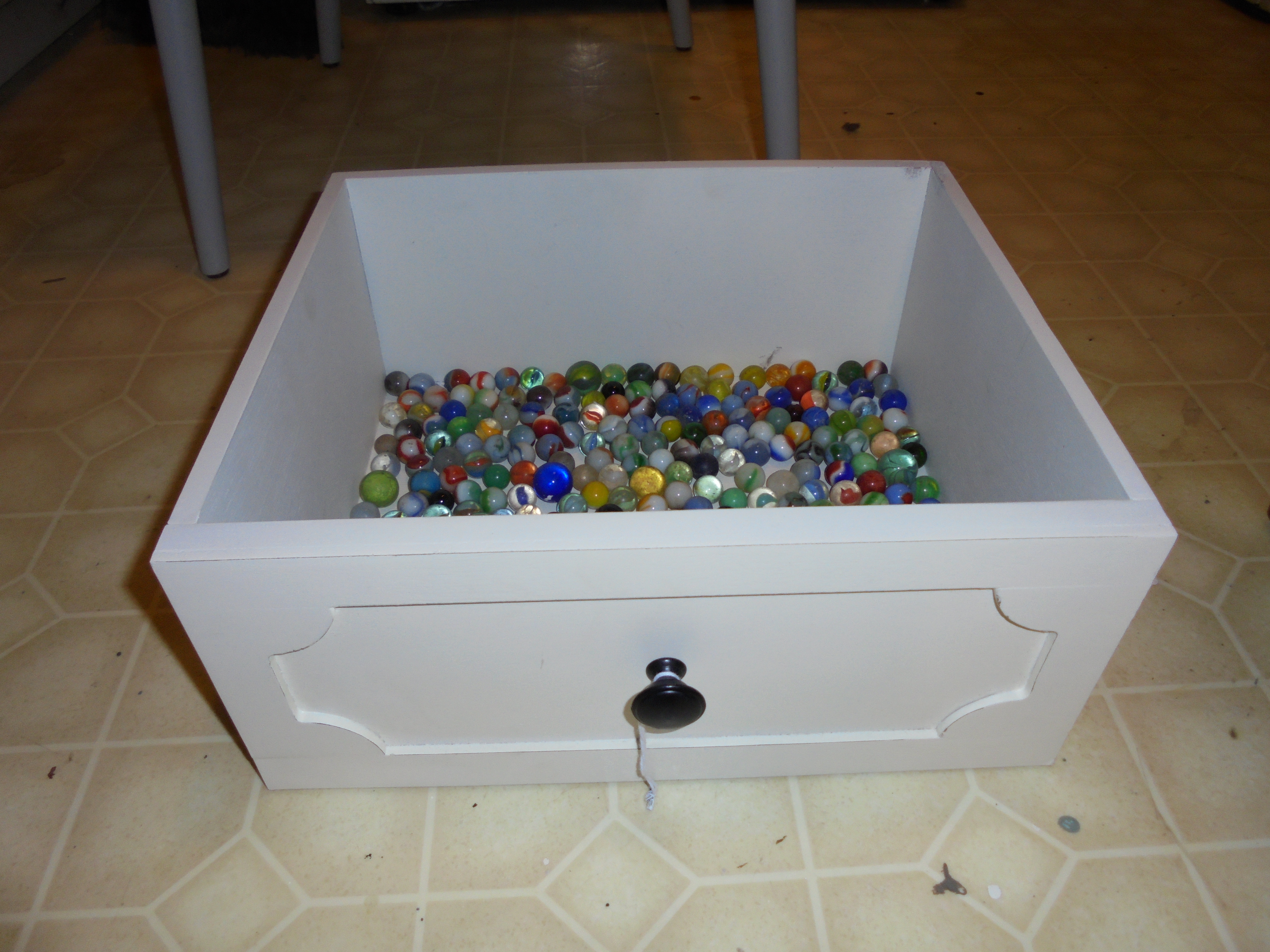 lot 226 image: DRESSER DRAWER with bunch of marbles