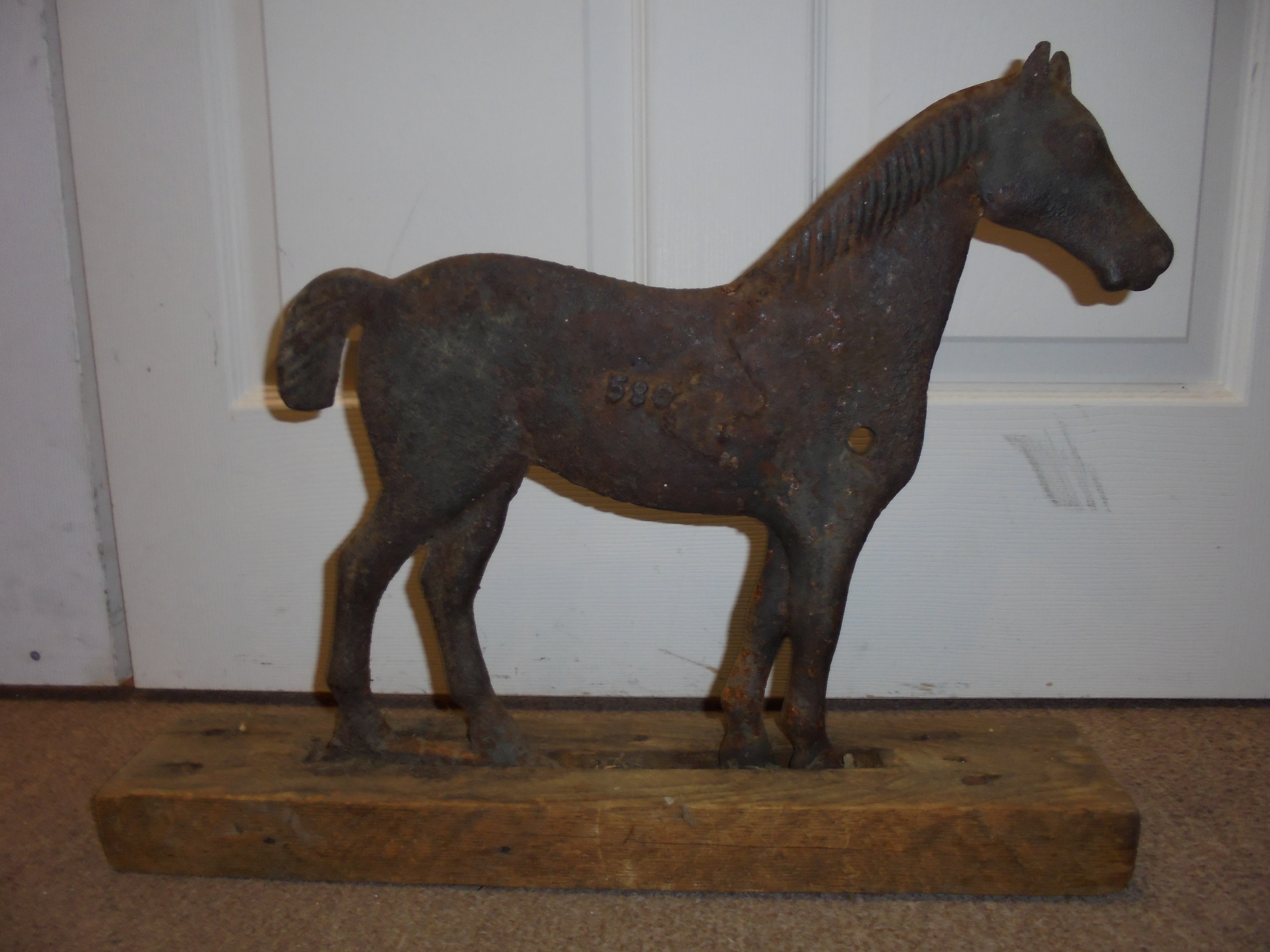 lot 8 image: Dempster Cast Iron Horse Windmill Weight 58G  - Look this up on ebay 
