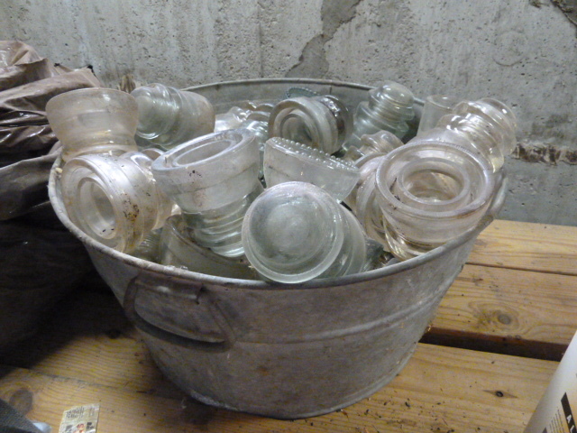 lot 359 image: LARGE METAL BUCKET FULL OF GLASS INSULATORS
