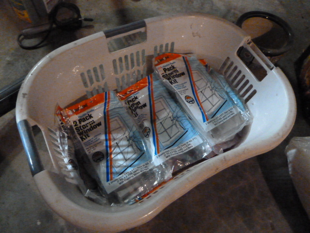 lot 356 image: 30 BRAND NEW PACKS OF STORM WINDOW KITS & LAUNDRY BASKET