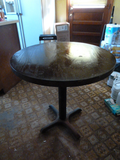 lot 351 image: DARK WOOD TABLE with metal base