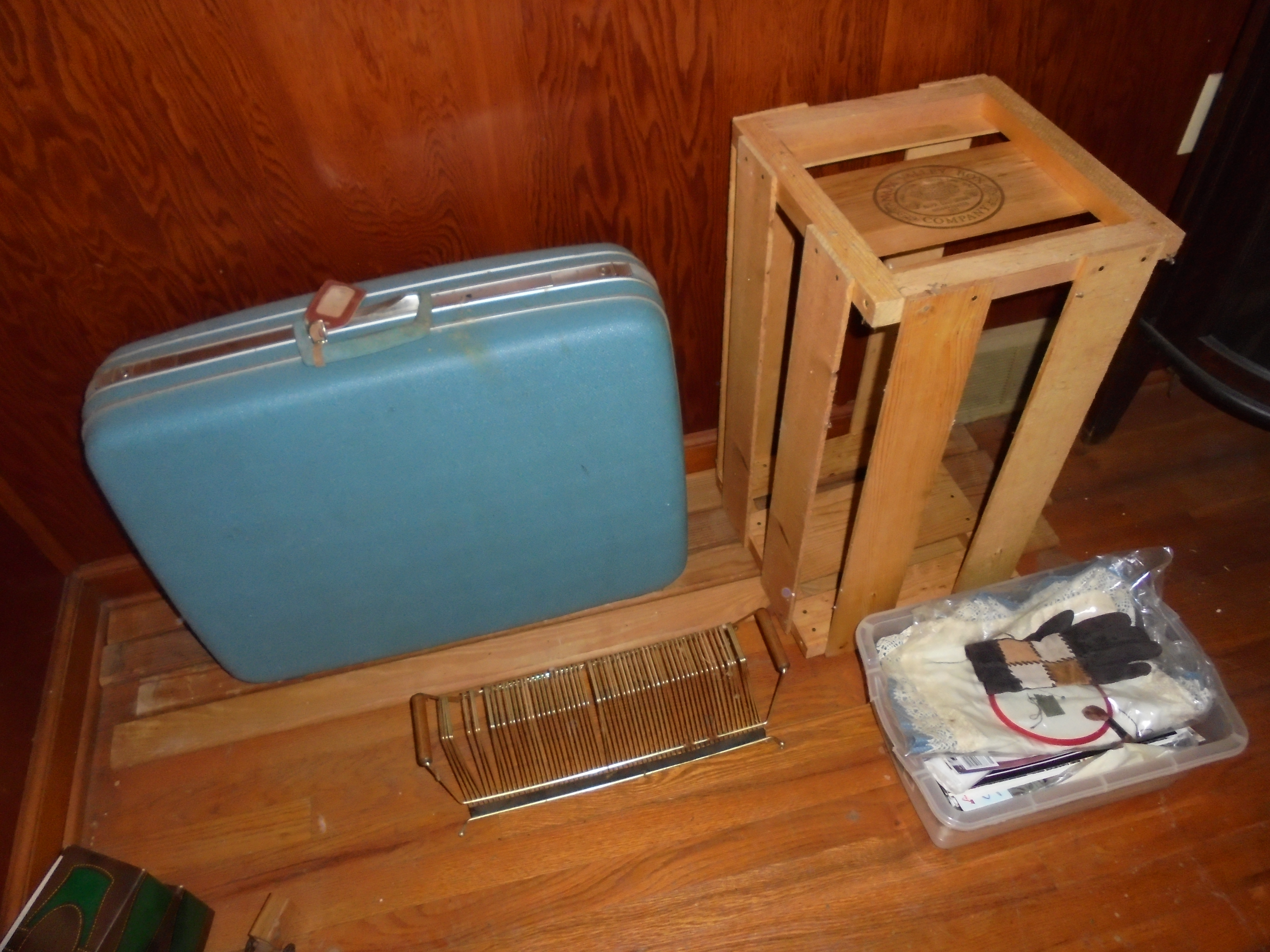 lot 320 image: suitcase, record rack, wooden crate, tote full of cross stitch stuff