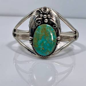 lot 34 image: Large Turquoise Blossom Cuff by Augustine Largo