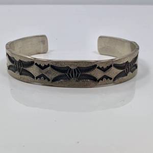 lot 38 image: Sterling Silver Stamped Cuff by Nora Tahe
