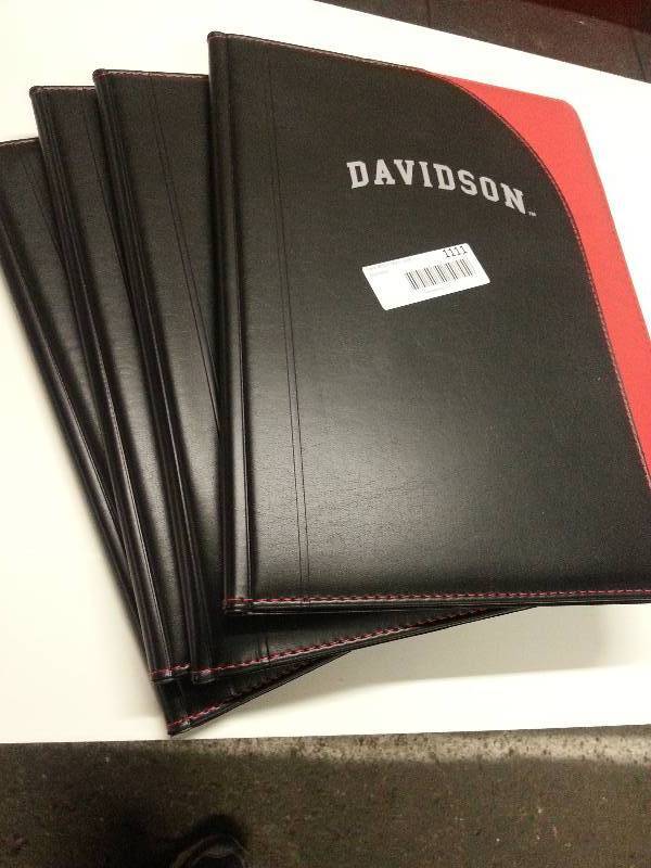 lot 9023 image: Package of 4 new good looking padded hard cover note books.  Even better if your name is Davidson.