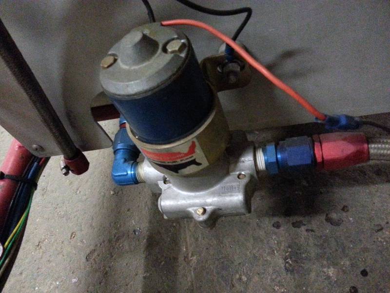 lot 1468 image: Holley Blue 110 Gallons per hour racing electric fuel pump and the fuel lines you need with it.