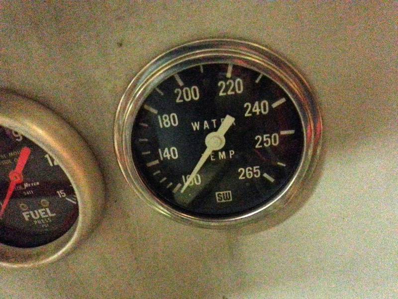 lot 1472 image: This lot is for all 3 large diameter racing gauges in the aluminum panel behind the seat and would include all lines and wiring required for them.