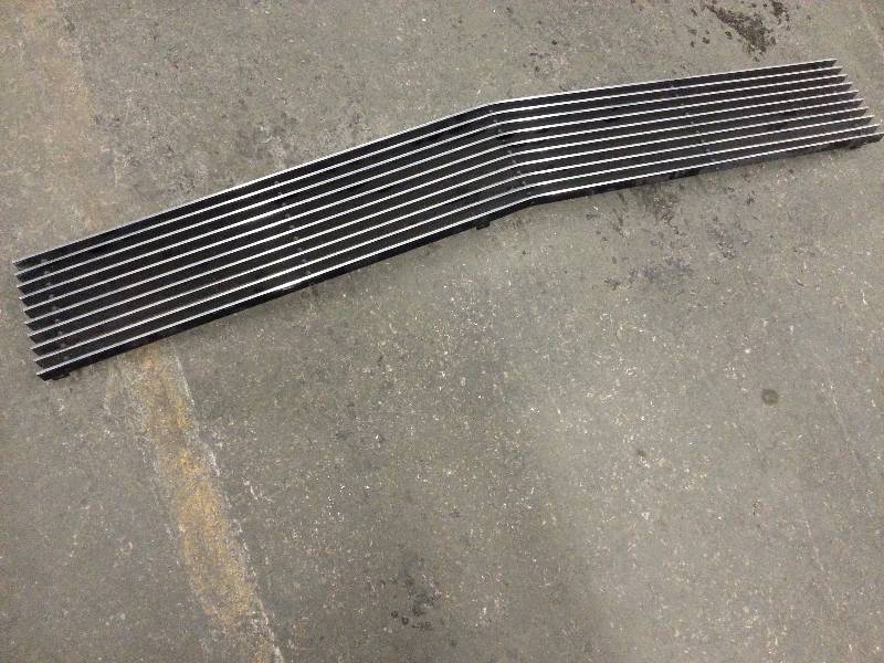 lot 1456 image: Fresh off a drag race 1966 Chevy II Nova and replaced with Carbon Fiber components is this billet aluminum replacement grill.