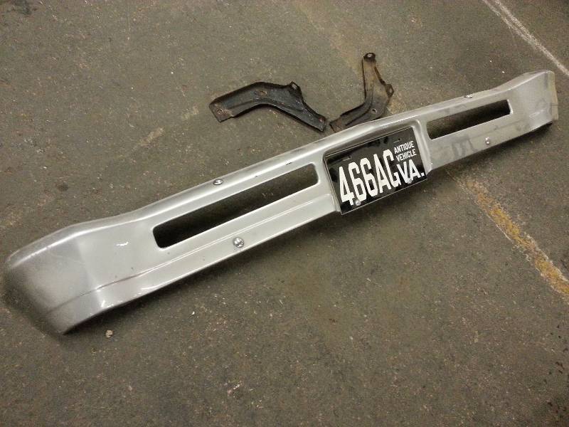 lot 1457 image: Very nice 1966-1967 Chevy II fiberglass front bumper with a pair of the factory steel Nova bumper brackets included.