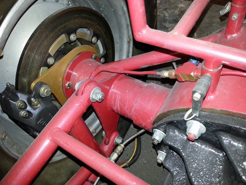 lot 1433 image: 26 flange to flange 9 Ford fabricated rear end housing complete with the Strange 33 spline axles but without the 3rd member.