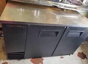 lot 120 image: True TBB-2-HC 58 78 Bar Refrigerator - 2 Swinging Solid Doors, Black, 115v with Stainless Top. CONTENTS NOT INCLUDED . Tested and Working WILL NEED TO BRING MEANS OF REMOVAL&nbsp