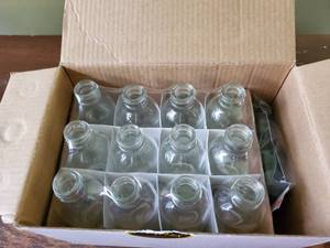 lot 3011 image: Viva Plex Box of 12 Clear 2 OunceGlass Bottles with Lids