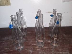 lot 2825 image: Lot of 7 Glass Sparkling Water Bottles