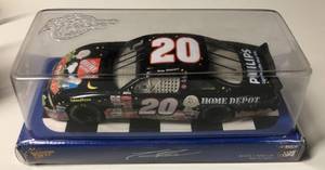 lot 1085 image: New In Box Tony Stewart #20 Diecast Black Car Home Depot 124 Scale