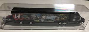 lot 1087 image: New In Display Case Tony Stewart #14 Black 164 Scale Tractor Trailer Truck with Car