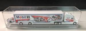 lot 1090 image: New In Display Case Tony Stewart #14 Mobile 1 164 Scale Tractor Trailer Truck with Car