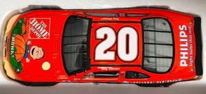 lot 1133 image: New In Box Tony Stewart #20 Diecast Orange Car Peanuts Great Pumpkin 124 Scale 2002 Grand Prix