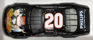 lot 1136 image: New In Box Tony Stewart #20 Diecast Black Car 124 Scale 2002 Grand Prix Peanuts Great Pumpkin