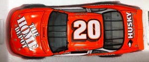 lot 1138 image: New In Box Tony Stewart #20 Diecast Orange Car 124 Scale 2000 Pontiac