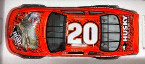 lot 1140 image: New In Box Tony Stewart #20 Diecast Orange Car 124 Scale 2001 Grand Prix Jurassic Park III