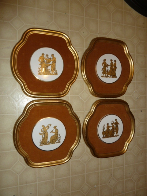 lot 326 image: LOT OF 4 WALL ART.  Think the center of each is porcelain but not 100% sure.