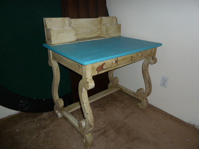 lot 422 image: OLD DESK with scrolly legs...has a chip out of the front of it...see pics
