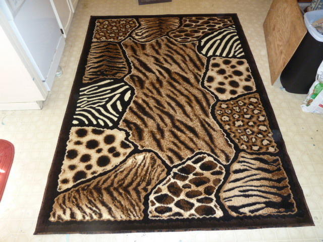 lot 51 image: BRAND NEW 5ft X 7ft Animal Print Area Rug