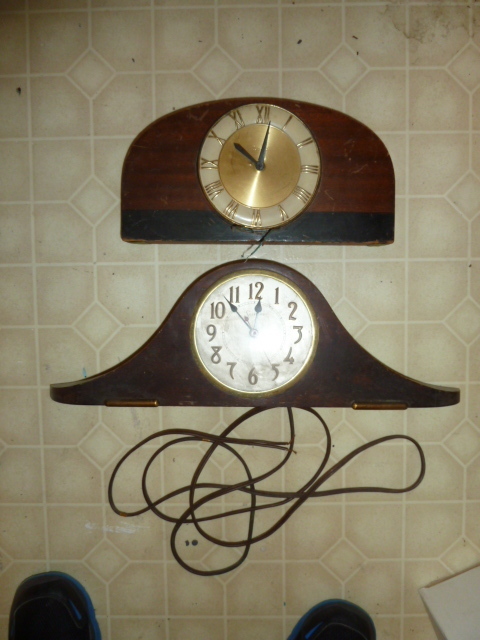 lot 661 image: PAIR OF COOL CLOCKS...dont appear to be in working condition