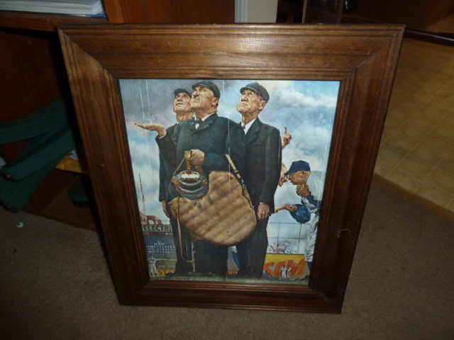 lot 676 image: BASEBALL UMPIRES Getting rained on print