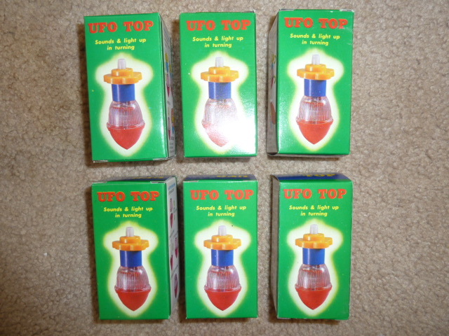 lot 263 image: 1950s  LOT OF 6  UFO TOPS still in the box
