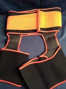 lot 52966 image: Orange And Black 3XL Workout Trainer