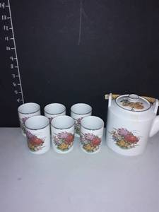 lot 1029 image: 8 pc. Napcoware Imported from Japan Tea Set. 1 pitcher with 6 cups.