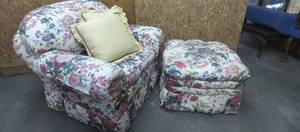lot 1110 image: Brunschwig and Fils floral lounge chair and rolling ottoman with 2 down feather accent pillows