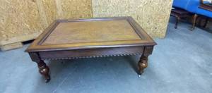 lot 1114 image: Cherry wood rolling cocktail table 21 x 50 x 36 in