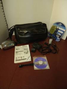 lot 1513 image: Panasonic Video Camera, Empire all in one Panasonic replacement digitalvideo charger and other accessories bag included