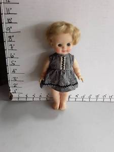 lot 2002 image: Blonde Doll in black and white checkered dress.