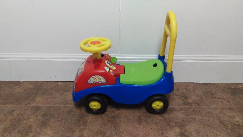lot 34 image: Childrens Push and Ride Car with Real Sounds