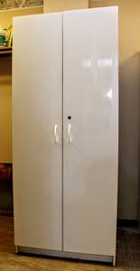 lot 8134 image: Tall White Floor Storage Cabinet with Doors, Adjustable Shelving 71.5 T x 30 W x 15.5 D