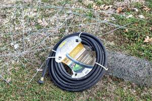lot 8175 image: Garden Lot - New WaterWorks 50 Soaker Hose, Chicken Wire  (3) Tomato Cages