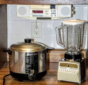 lot 8233 image: Vintage Kitchen - Sunbeam Electric CookerDeep Fryer, Osterizer Imperial Blender  GE Spacemaker CD Clock Radio (it works great)
