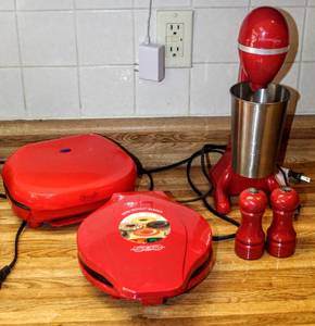 lot 8239 image: Red Kitchen Lot - Kitchen Living Milk Shake Maker, Bella Cucina Mini Donut Maker, Nostalgia Electronics appliance  Salt & Pepper Shakers