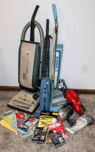 lot 8253 image: (3) Eureka Vacuums, (1) Dirt Devil Scorpion Hand Vac, (1) Pet Hair Hand Vac  Variety of Vacuum Bags