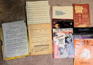 lot 8295 image: Sheet Music Lot - Show Boat, Barbara Streisand, Eddie Rabbit, Choral Music  stack of blank music sheets