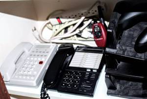 lot 8352 image: Office Lot including Dell Docking Station, Motorola Walkies, Desk Organizer, (2) Office Phones, (2) Microsoft Gaming Controllers, Surge Protector and Extension Cords