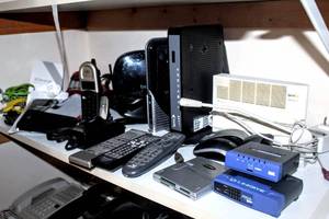 lot 8348 image: Office Shelf FULL of Products inland MultiPlus Card Reader, Stratitec, Belkin, Linksys, Airave 2.5, Cordless Phones, Phone Accessories and more