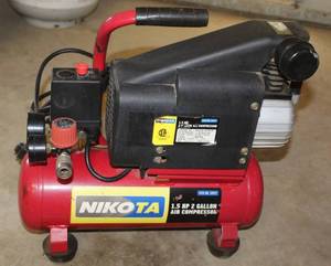lot 8227 image: NIKOTA  1.5 HP 2 Gallon Air Compressor - Powered on and Works