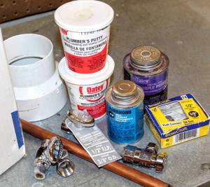 lot 8401 image: Plumbers Lot, Plumbers Putty, PVC Bond, New Valves, PVC