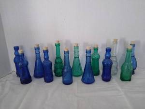 lot 1966 image: 13 Small colored glass bottles wcorks