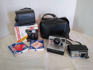 lot 1977 image: Polaroid ProntoB land camera, Polaroid one step camera and 2 600 count boxes of film