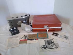 lot 1976 image: Polaroid 800 with a photoelectric shutter and wink- light in Polaroid case